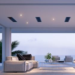 White recessed ceiling light fixture with warm glow, installed in modern ceiling alongside solar panels and ambient lighting